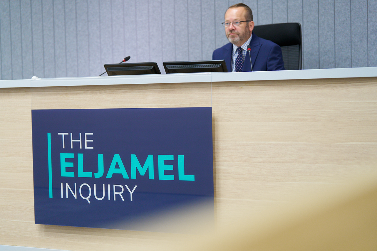 Lord Weir, Chair of the Eljamel Inquiry, at his desk in the hearing room 